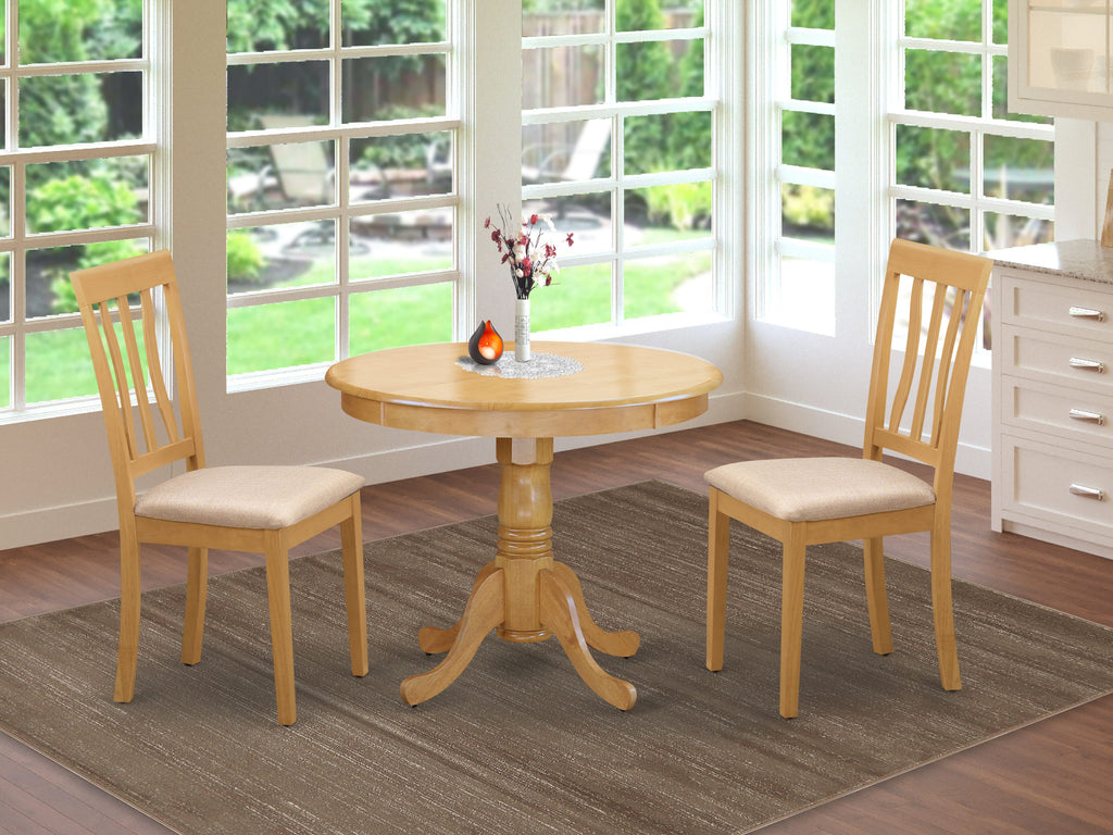 ANTI3-RDS-U Compact Dining Set - Round Pedestal Table and 2 Upholstered Chairs, Oak Finish